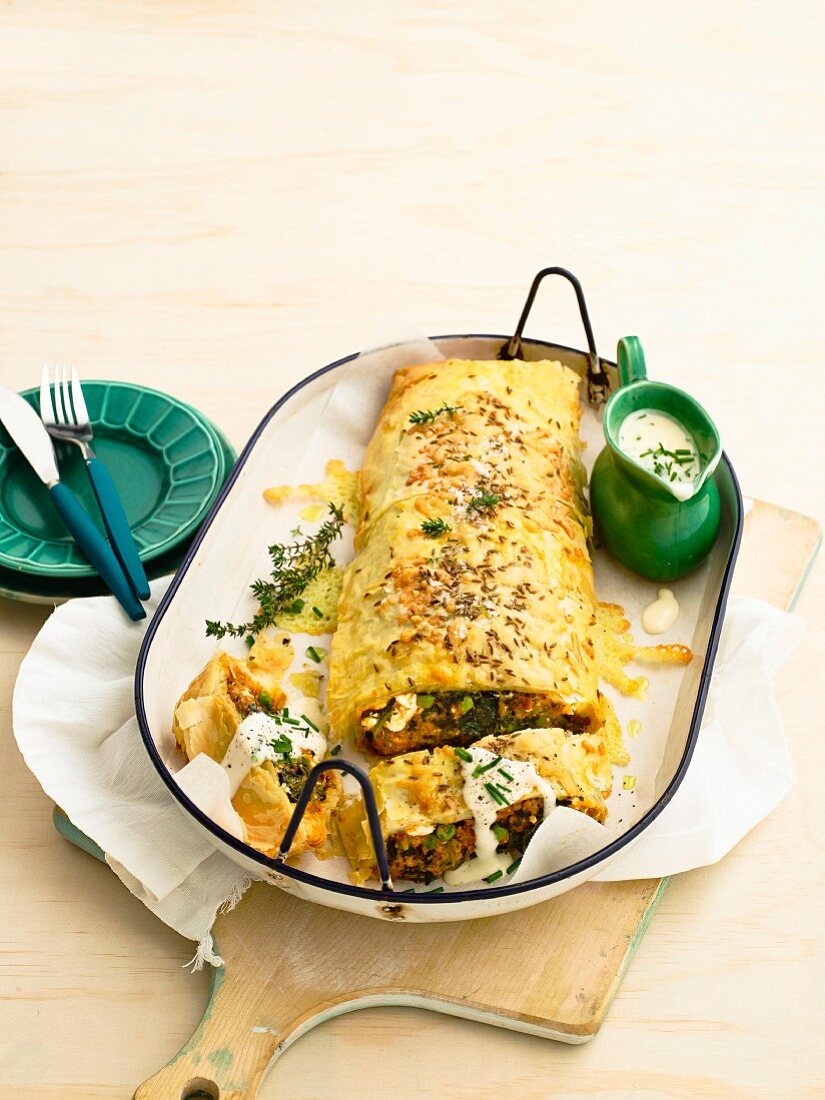 Moroccan lamb strudel with cheese sauce