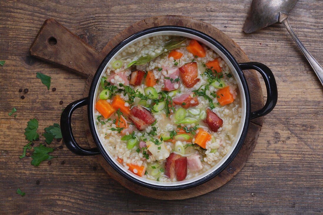 Barley stew with bacon and carrots