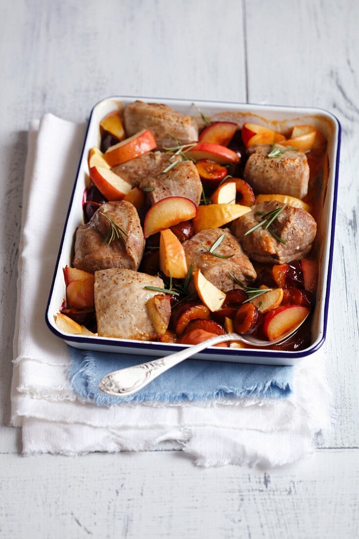 Oven-baked pork loin with plums and rosemary