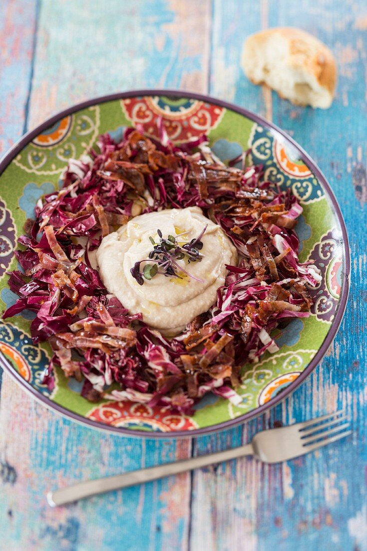 White bean purée on a bed of radicchio
