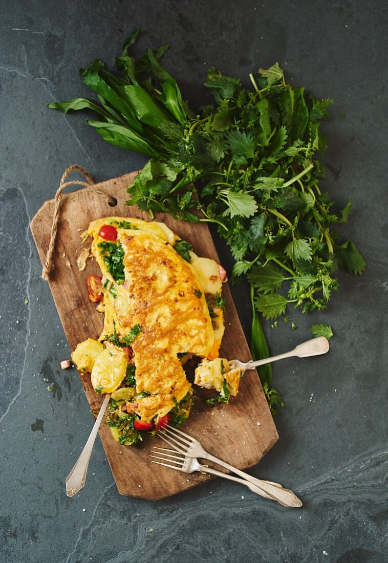 Classic country omelette with potatoes and vegetables