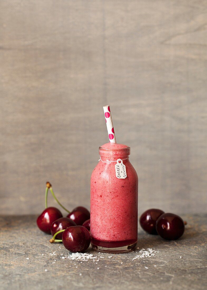 A cherry and coconut smoothie with cherries