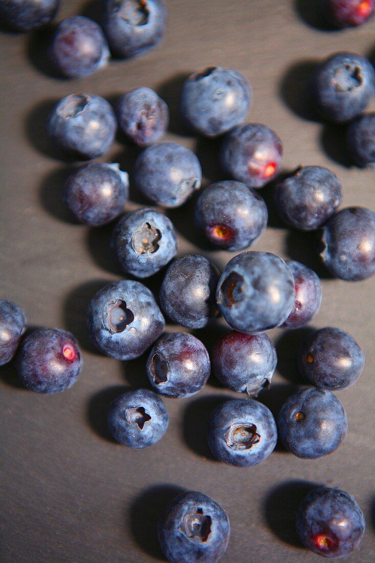 Blueberries on a grey surface