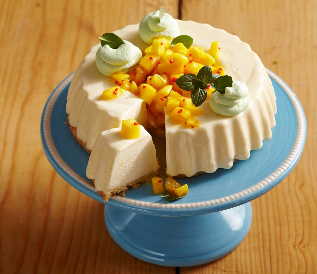 A mini creamy cheesecake with spicy mango salsa