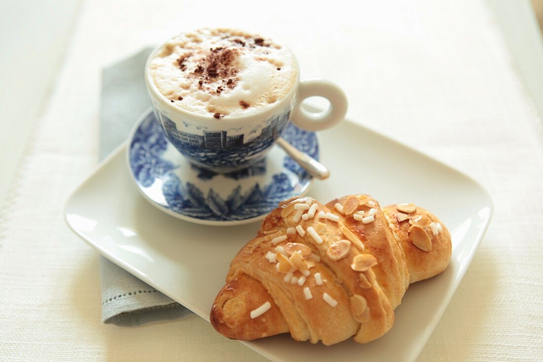 Cappuccino and an almond croissant