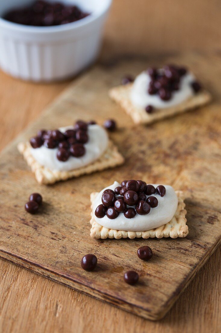 Biscuits with chocolate caviar and cream