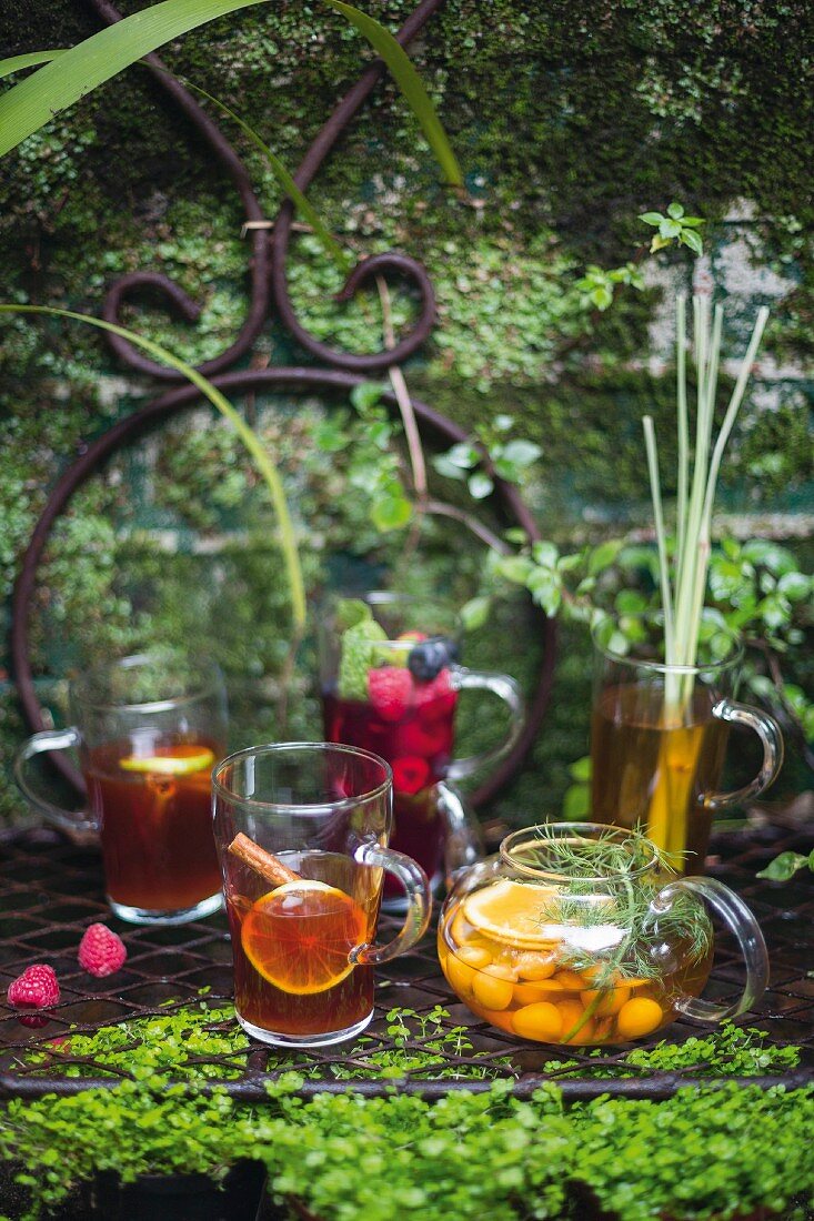 Various summer drinks on a garden table