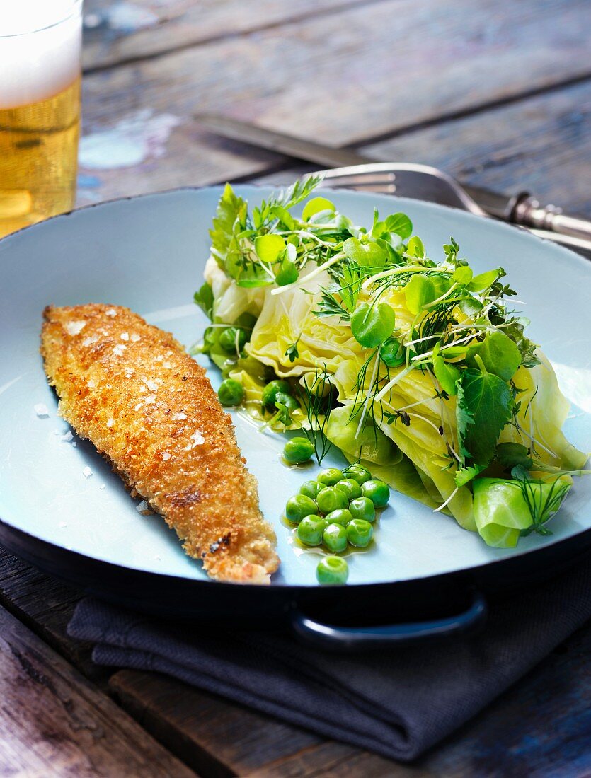 Pointed cabbage with peas, garlic oil and breaded sole