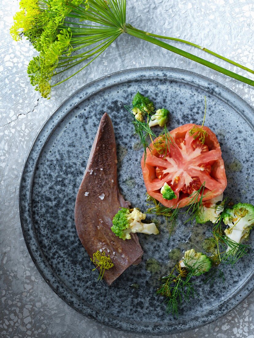 Veal tongue with Romanesco florets, dill and tomatoes