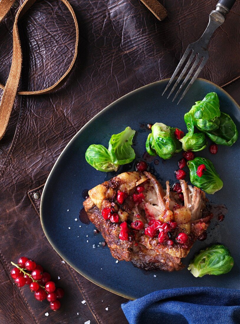 Pork belly with redcurrants and Brussels sprouts