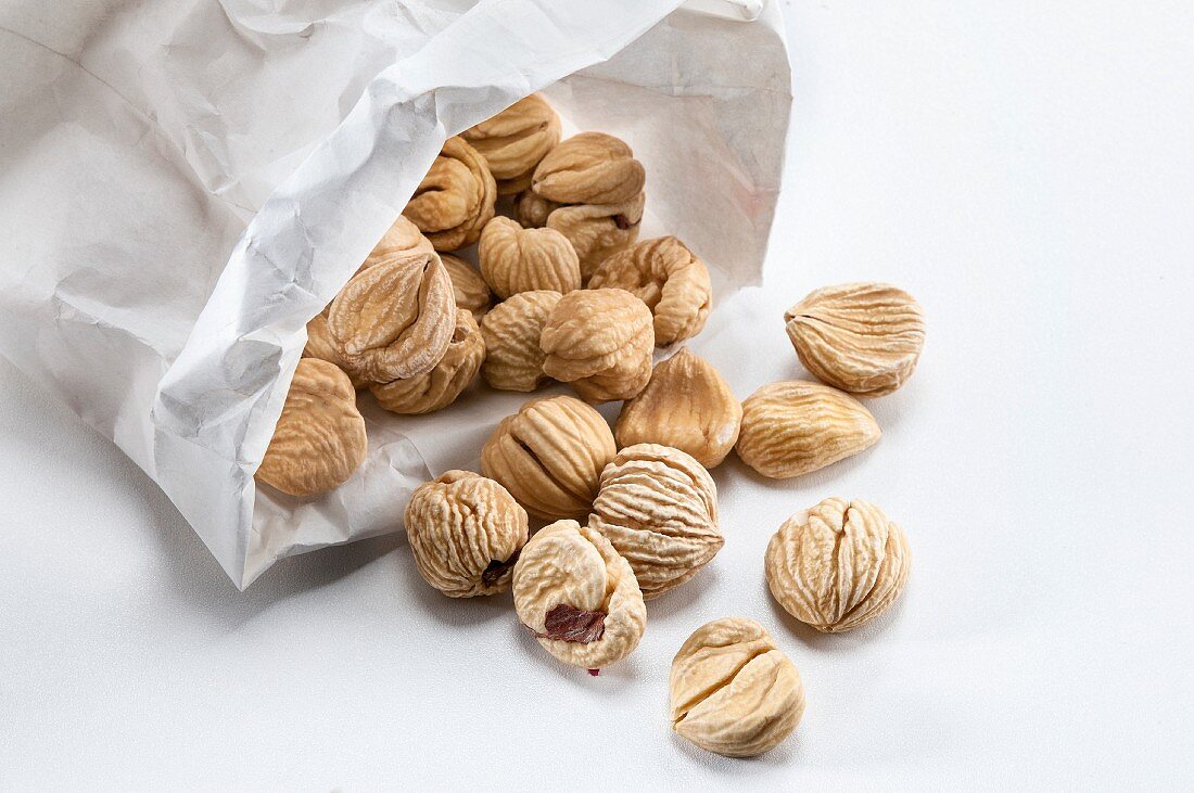 Dried chestnuts in a paper bag