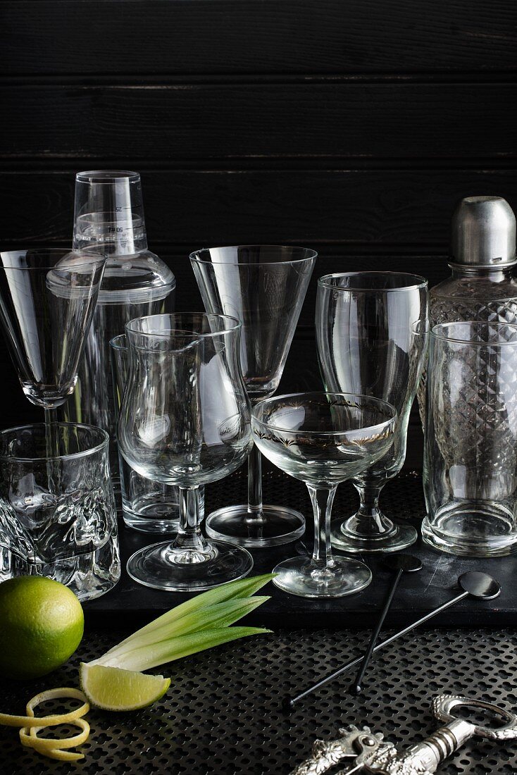 Various cocktail glasses and bar utensils