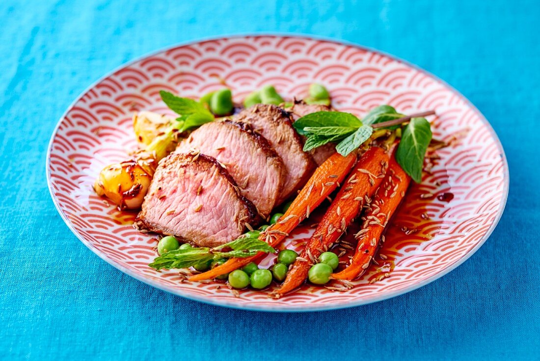 Lamb fillet with carrots and peas