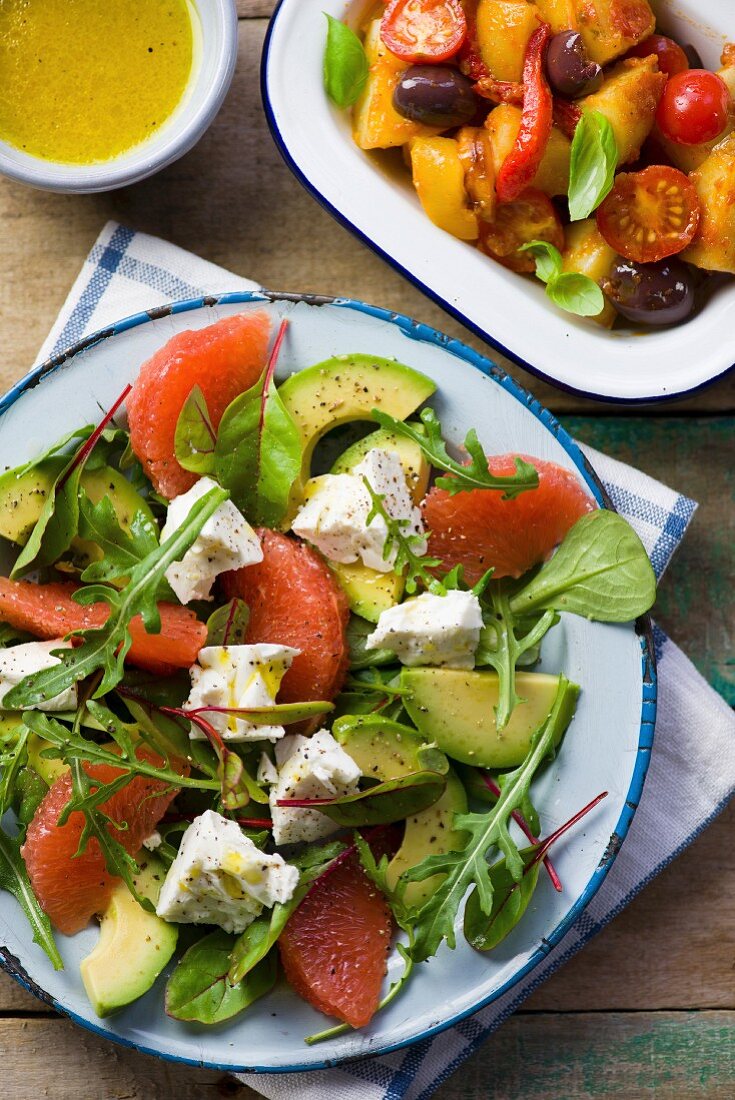 Avocado salad with grapefruit, and a roast vegetables salad with olives