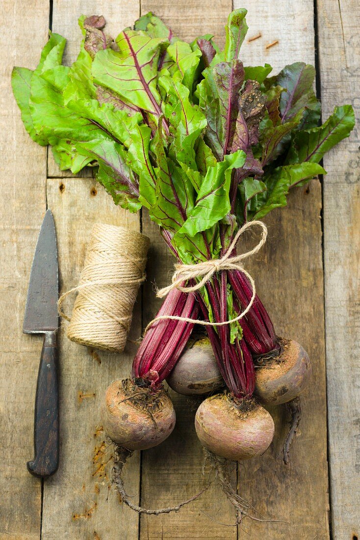 A bundle of beetroot on a wooden surface