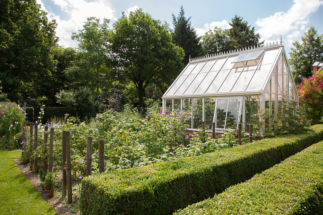 Victorian greenhouse in idyllic garden