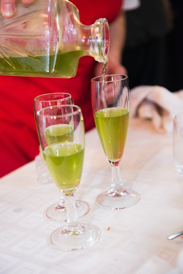 An aperitif being poured