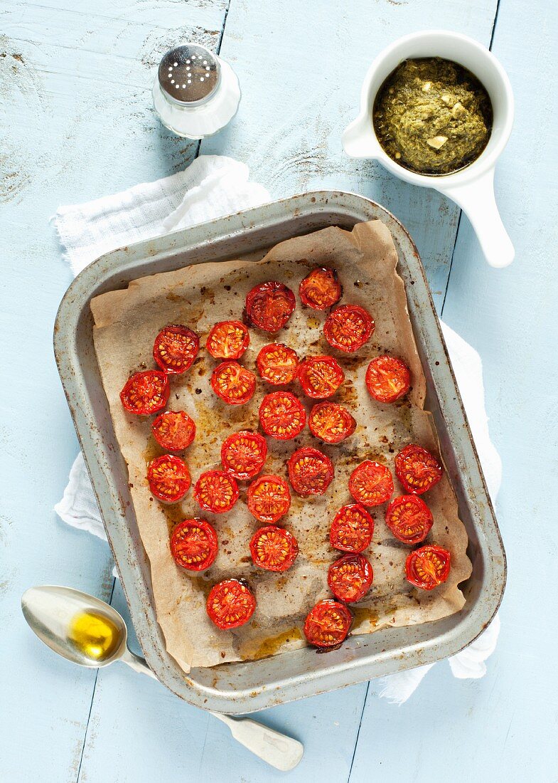 Roasted cherry tomatoes on a baking tray