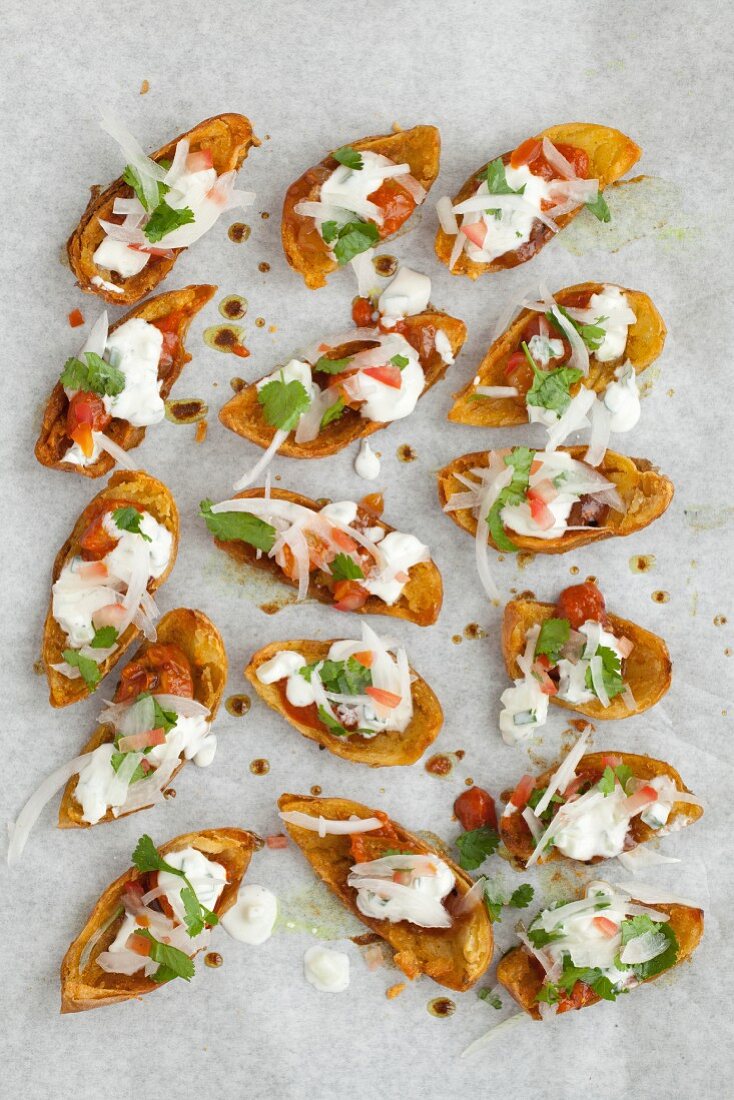 Baked potato skins filled with Indian salad