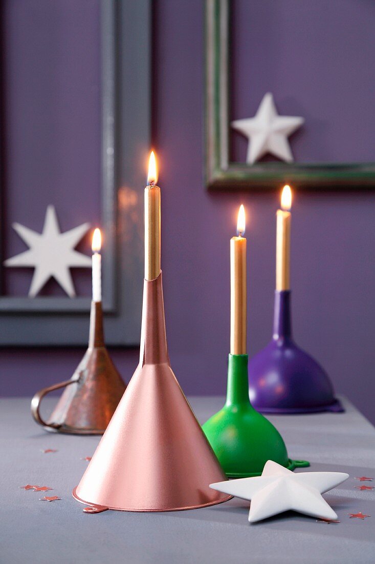 Upturned funnels used as candlesticks