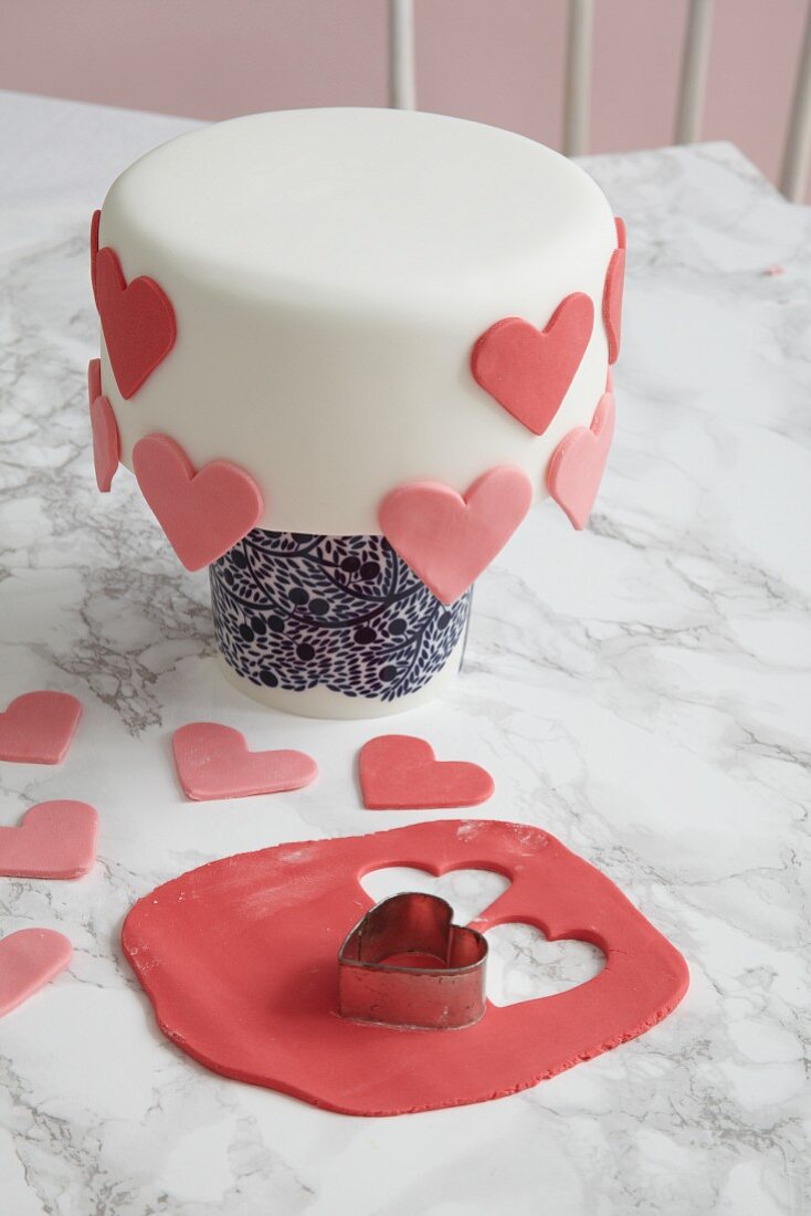 A Madeira cake decorated with overhanging hearts