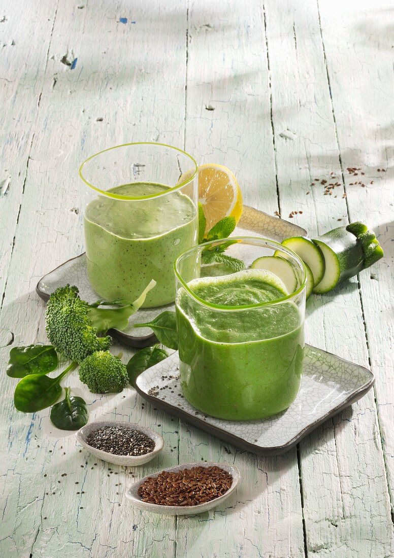 Green smoothies: a broccoli and apple smoothie and a spinach and kiwi smoothie