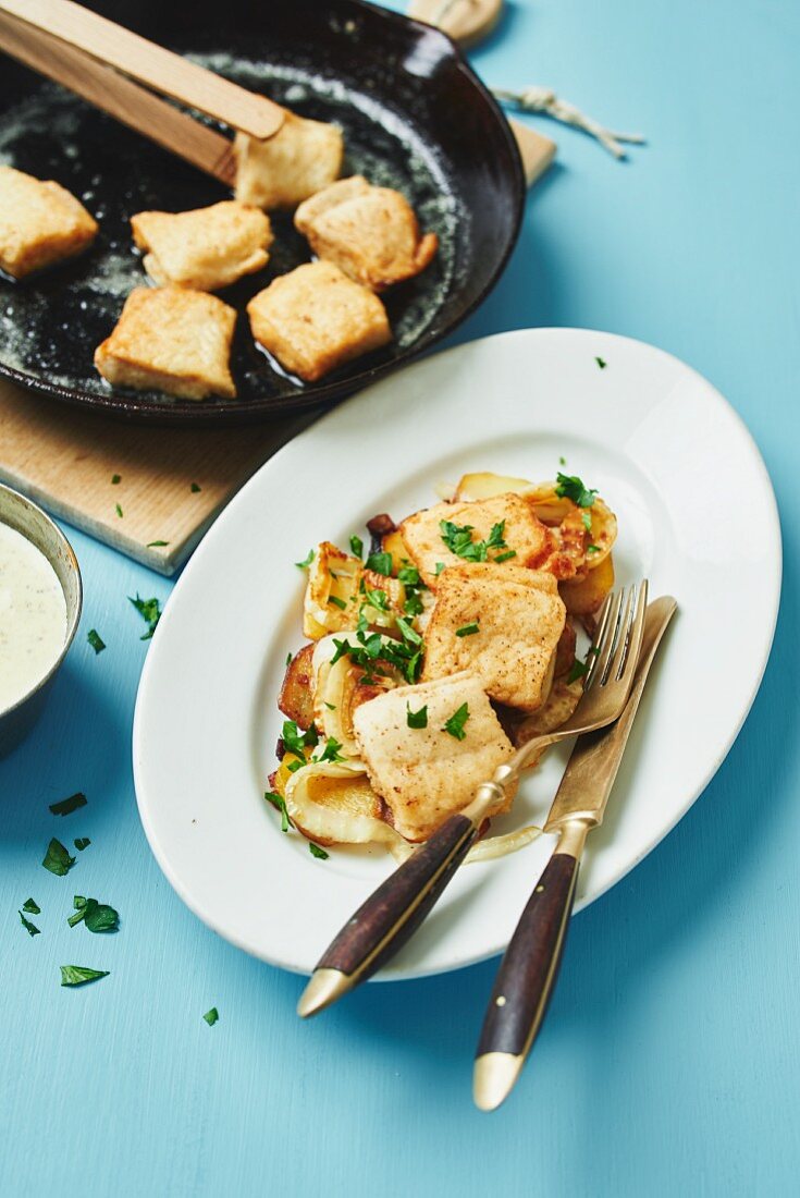 Pannfisch (dish made using leftover fish) with a mustard sauce