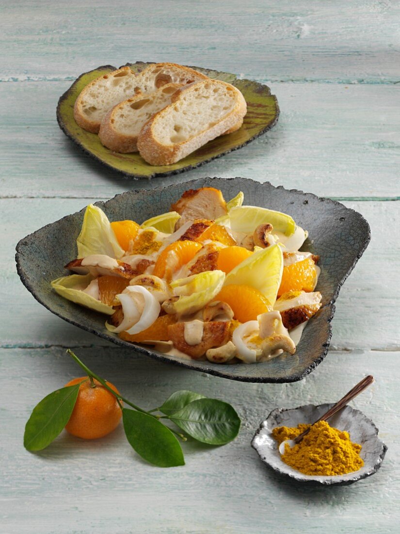 Chicken salad with chicory, mandarins and cashew nuts