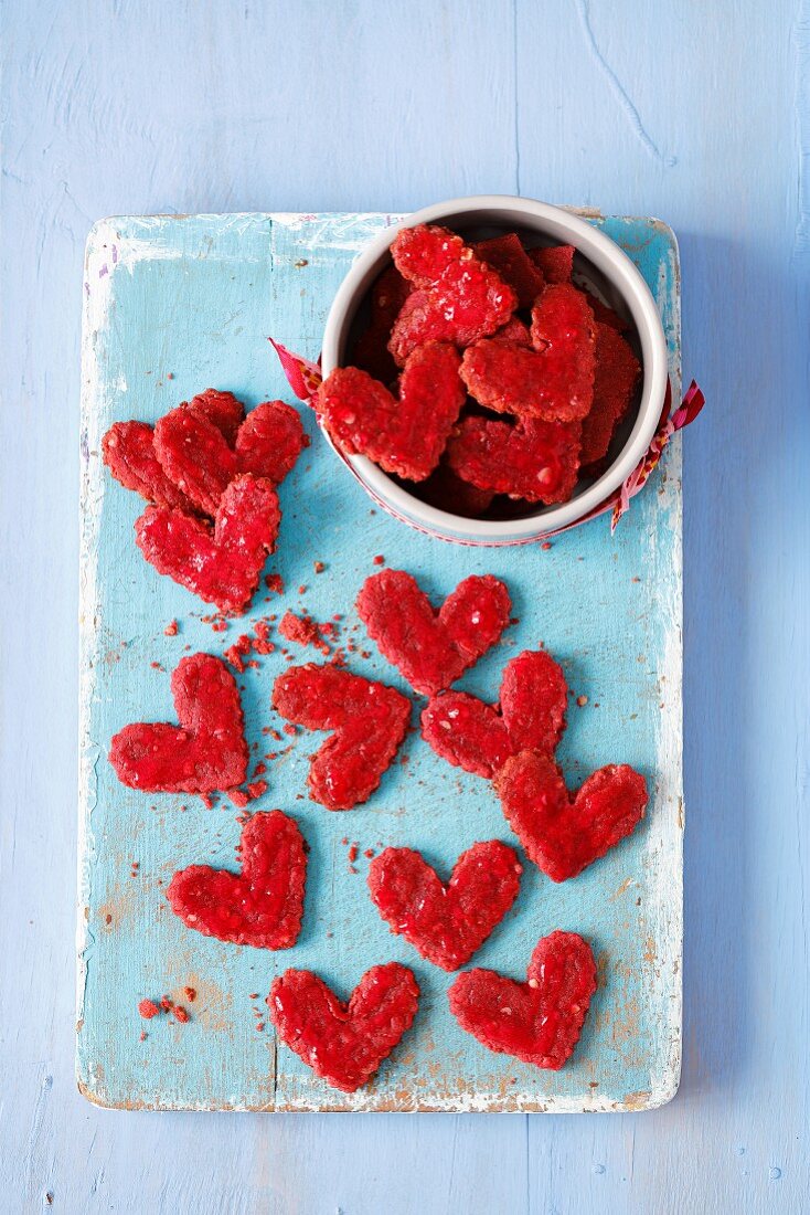 Treats for a dog - hear-shaped biscuits made with beetroot juice, oats, wholemeal flour and beetroot jelly