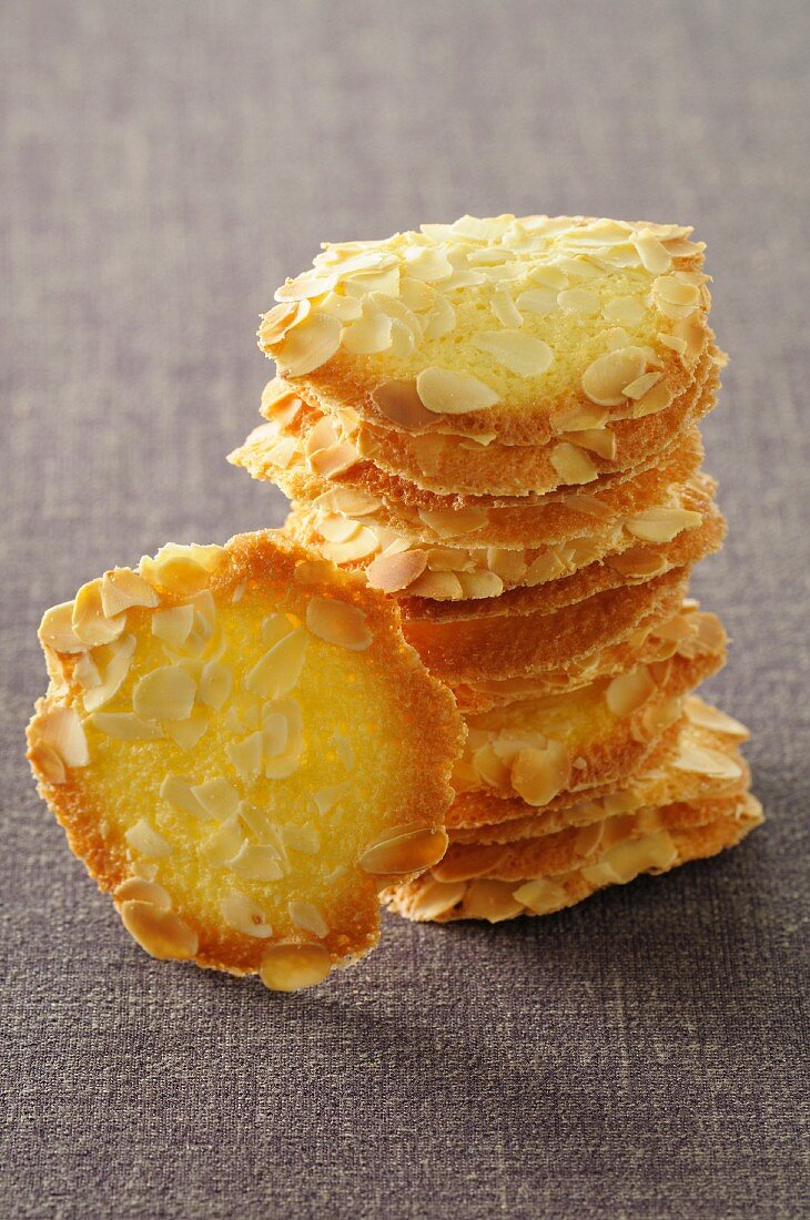 A stack of tuiles with flaked almonds