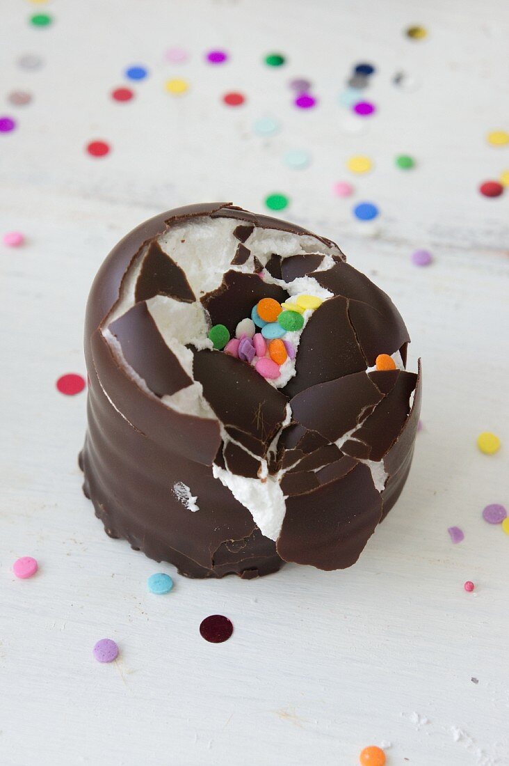 A crushed chocolate candy with sugar confetti