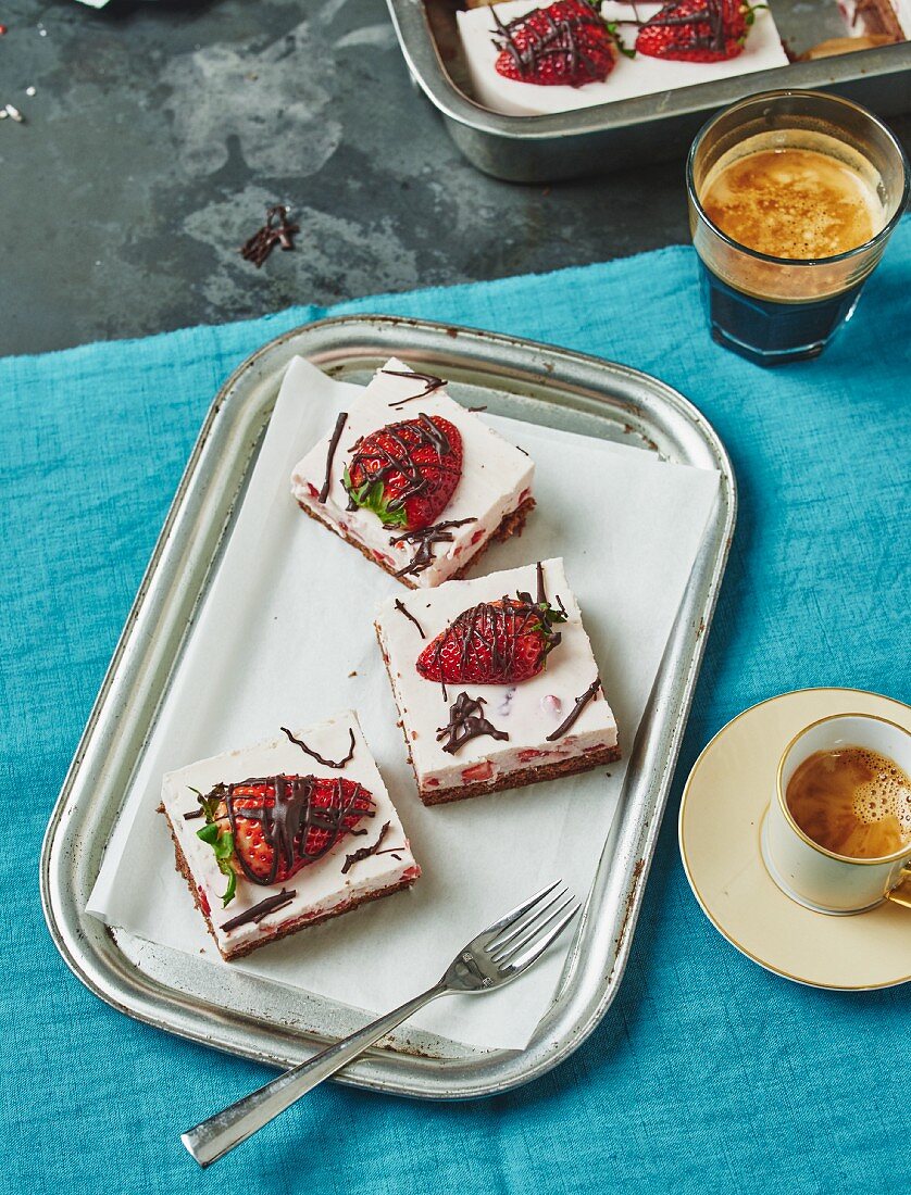 Strawberry cake slices served with coffee