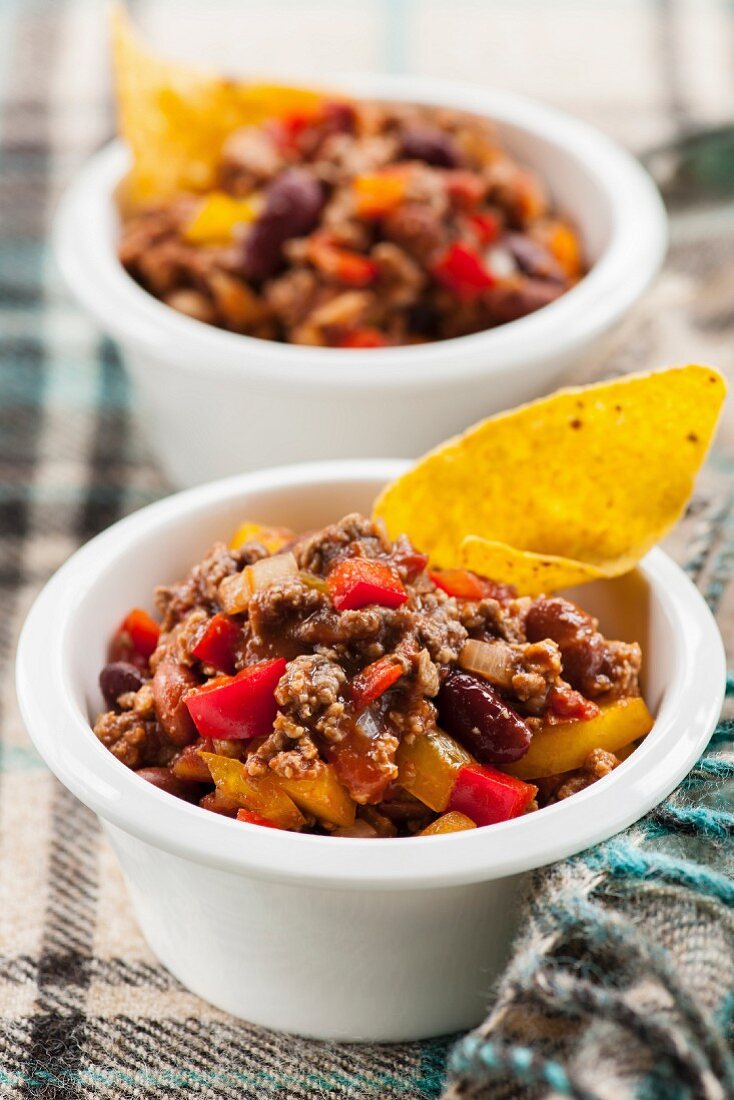 Chili con carne in cup with tortilla chips