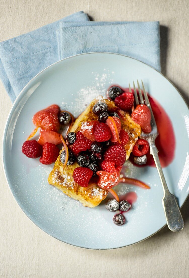 French toast with raspberries, lingonberries and strawberries