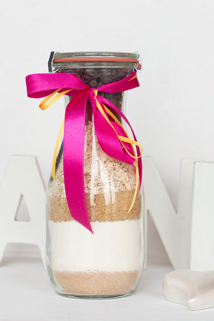 A baking mixture for oat biscuits in a glass bottle as a gift
