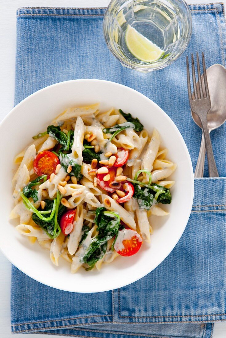 Penne with spinach, blue cheese, tomatoes and pine nuts