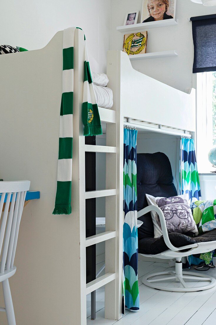 Modern dining table and green chairs in interior of period apartment