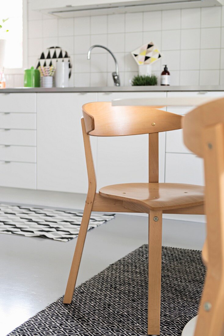 Scandinavian chairs in white kitchen