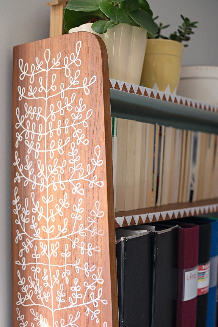 Retro shelves painted with leaves and triangles