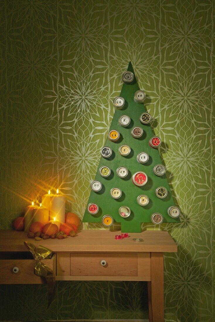 DIY Advent calender made from tin cans stuck on stylised Christmas tree