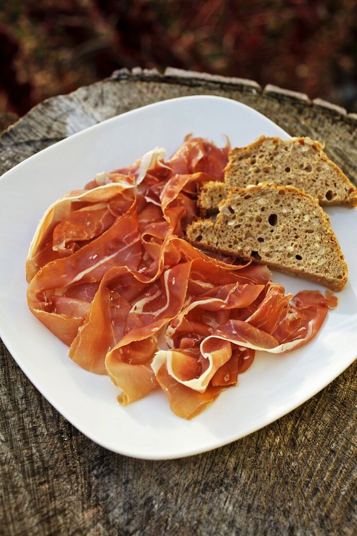 Country ham with bread on a plate