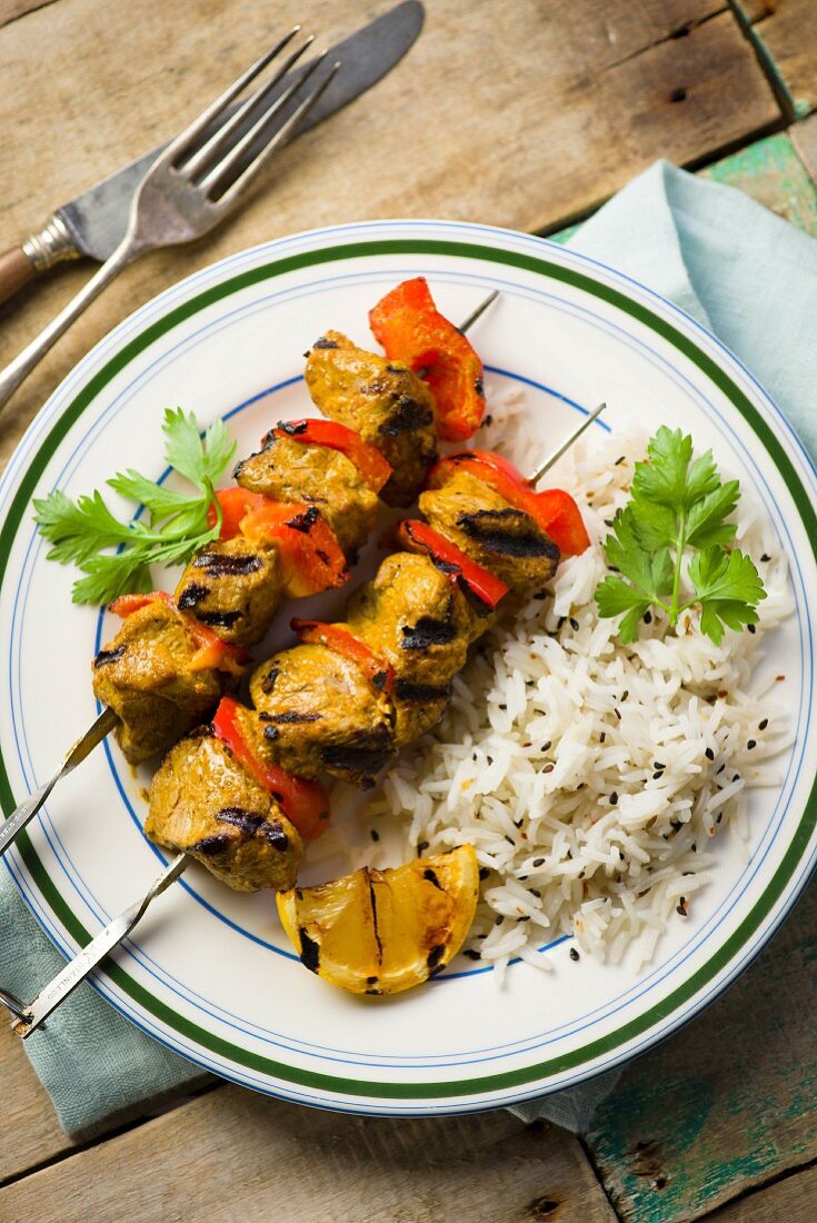 Spicy lamb kebabs with rice