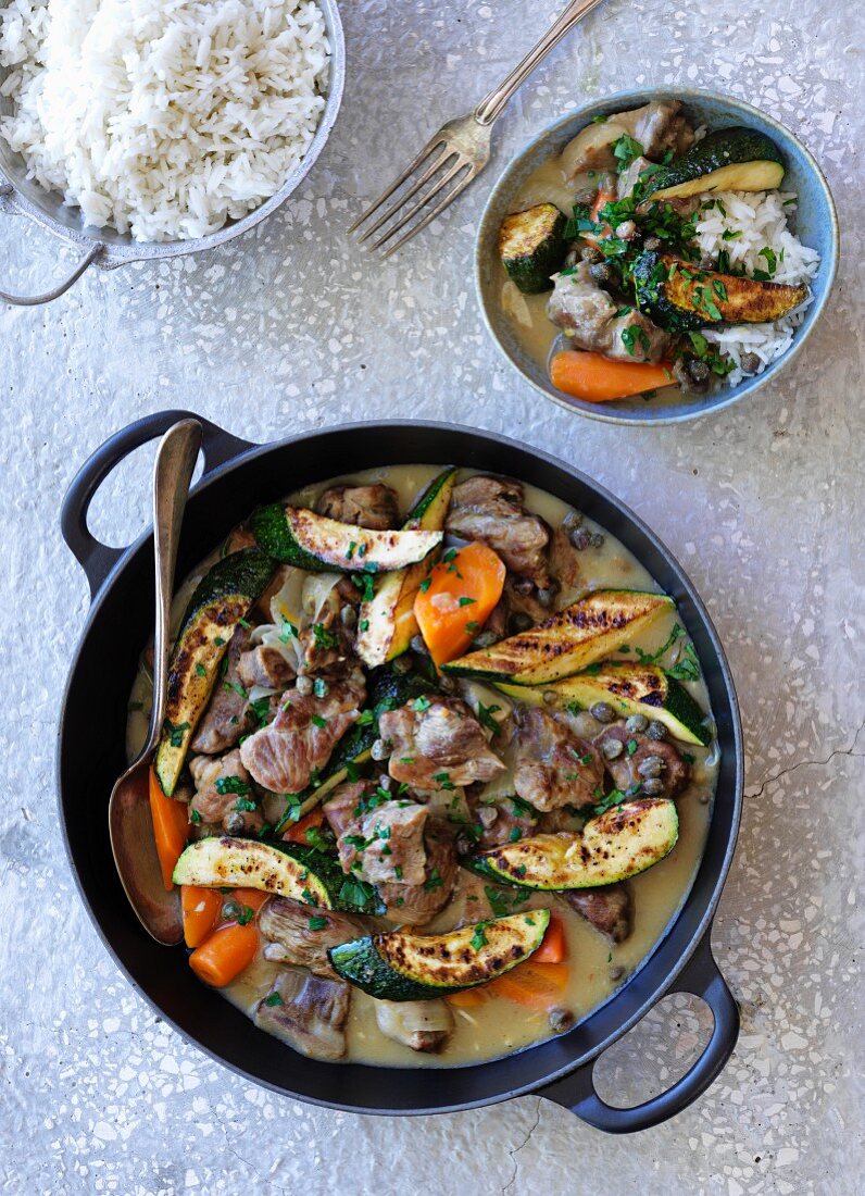 Lamb stew with vegetables and lemon served with rice