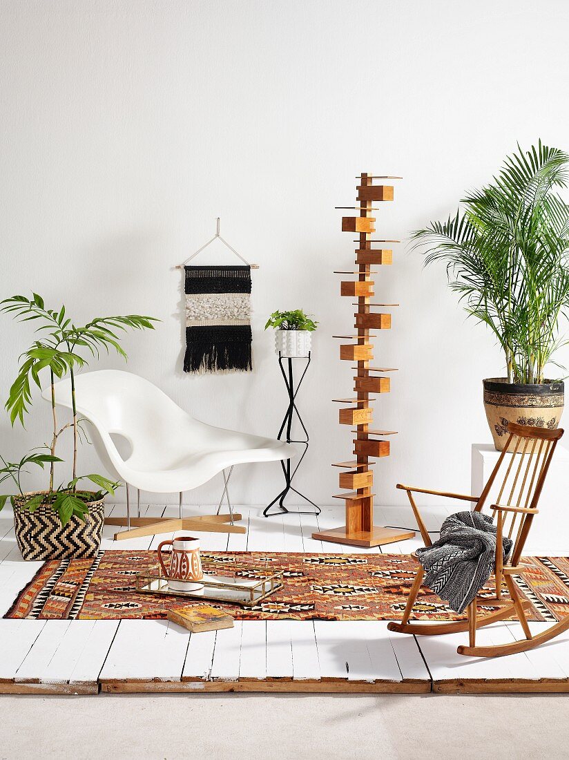 Classic chair, designer standard lamp, simple rocking chair and house plants