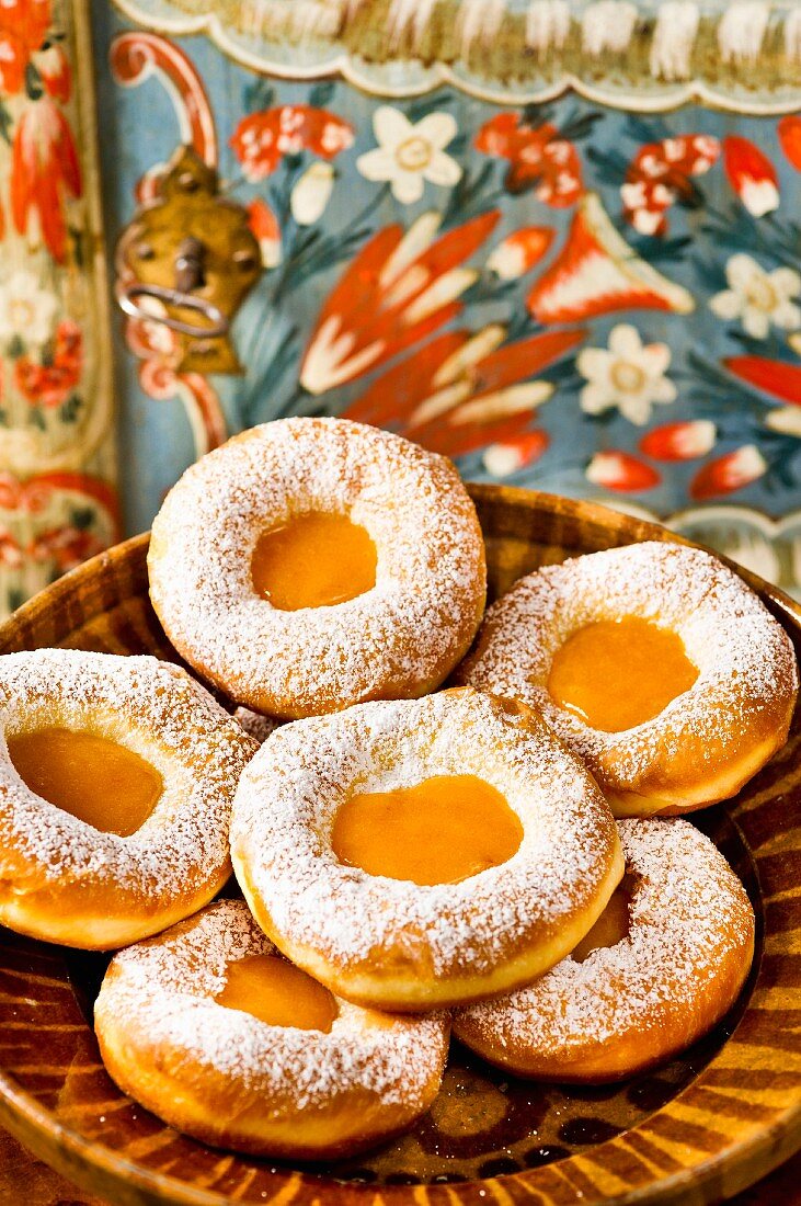 Doughnuts with marmalade jam and icing sugar