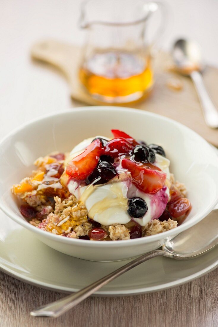 Oats with fruit, yoghurt and honey for breakfast