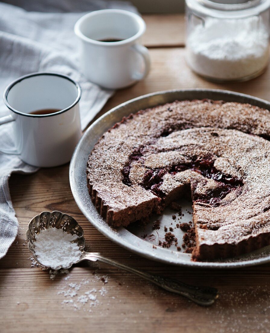 Chocolate tart with cherry jam and coffee