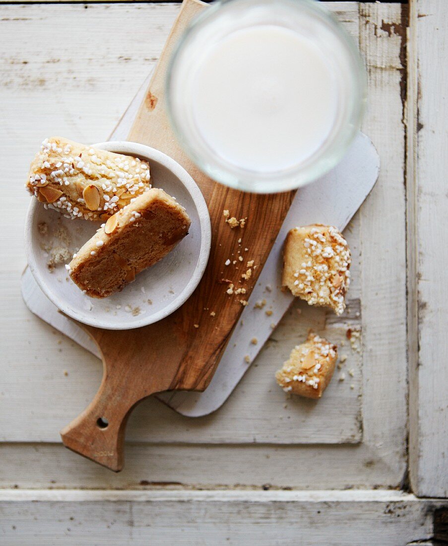 Finnish bread rolls with sugar nibs, almonds and milk