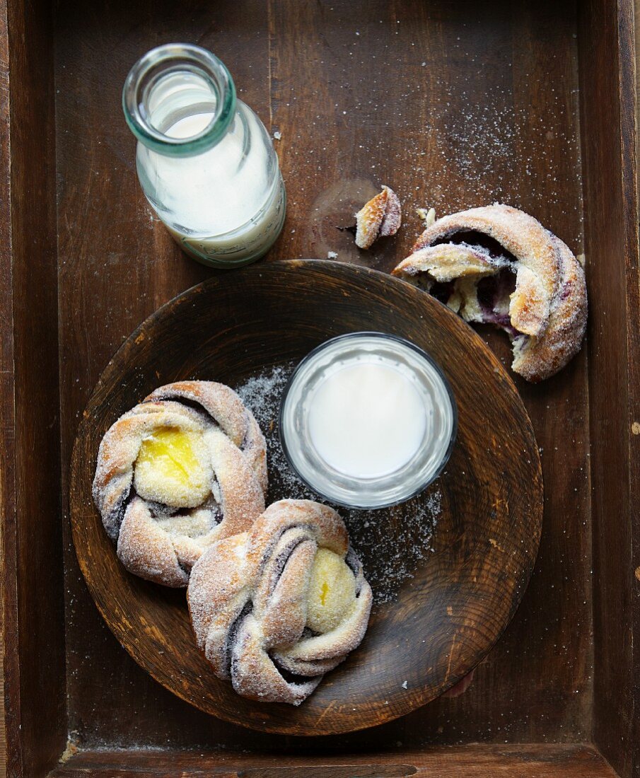 Pastries with vanilla cream, marzipan and blueberry jam