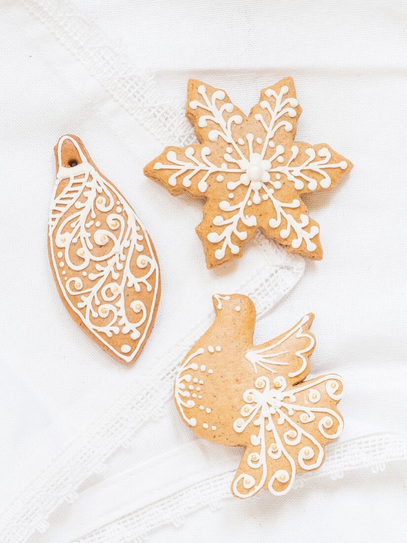Homemade gingerbread biscuits decorated with white icing